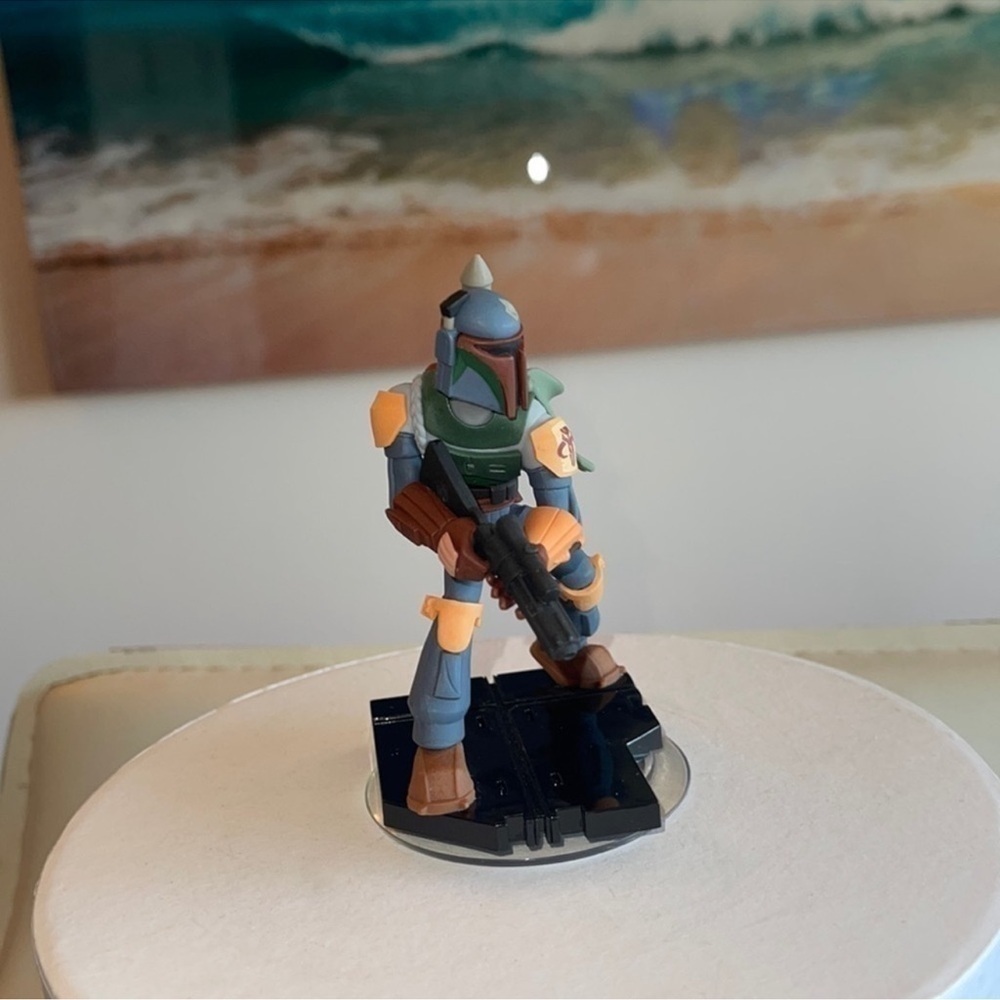 Action Figure on Blue Toy Car